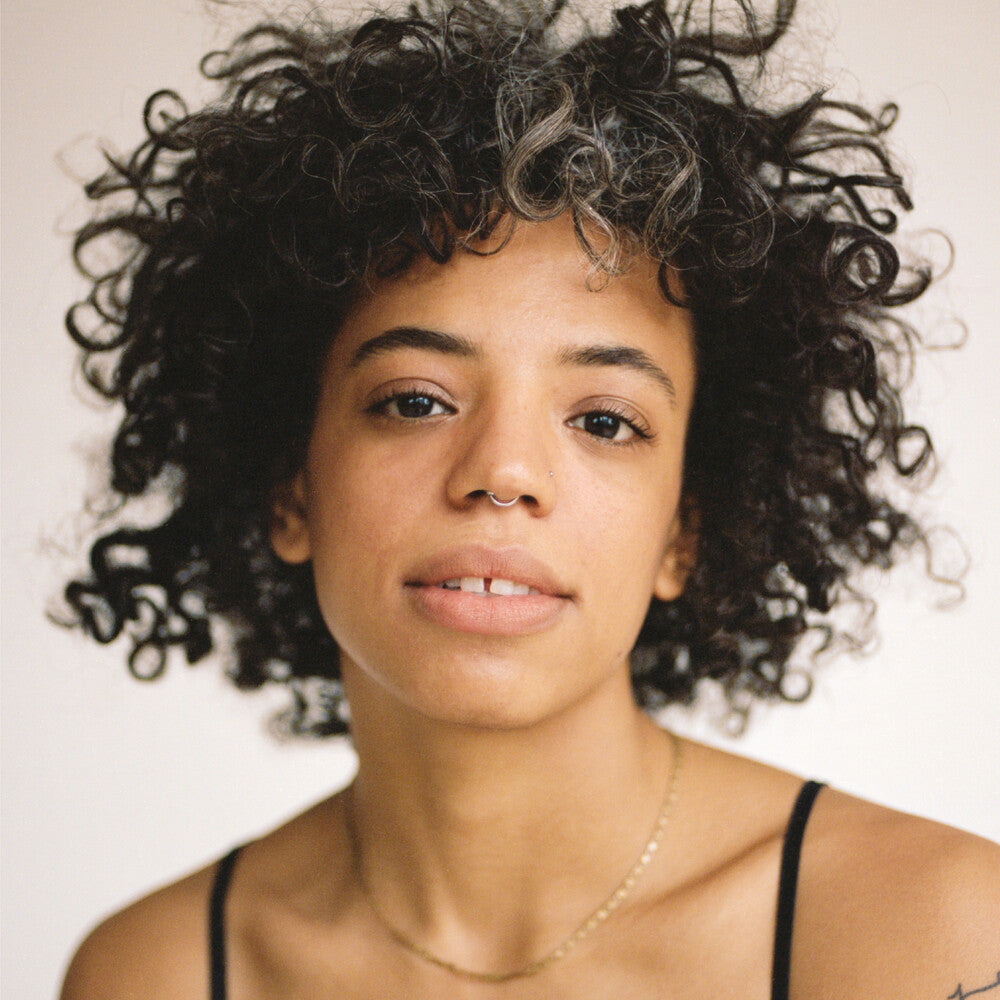 the album cover for Tasha - Tell Me What You Miss The Most [Opaque Bone LP]