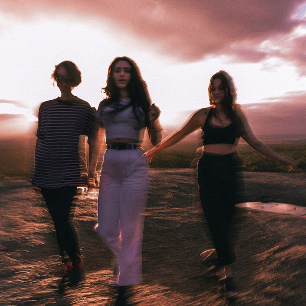 the album cover for Camp Cope - Running With The Hurricane [Neon Violet LP]