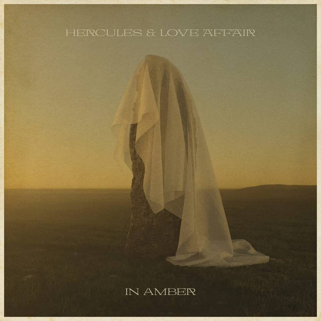 the album cover for Hercules & Love Affair - In Amber [Indie Exclusive Limited Edition Gold LP]