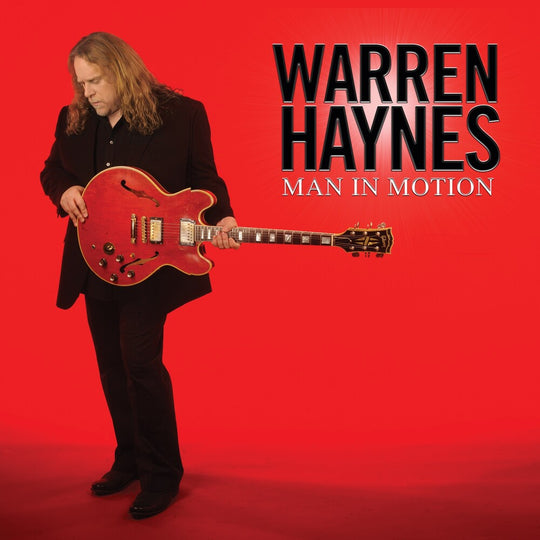 the album cover for Warren Haynes - Man In Motion [Limited Edition Translucent Ruby 2LP]